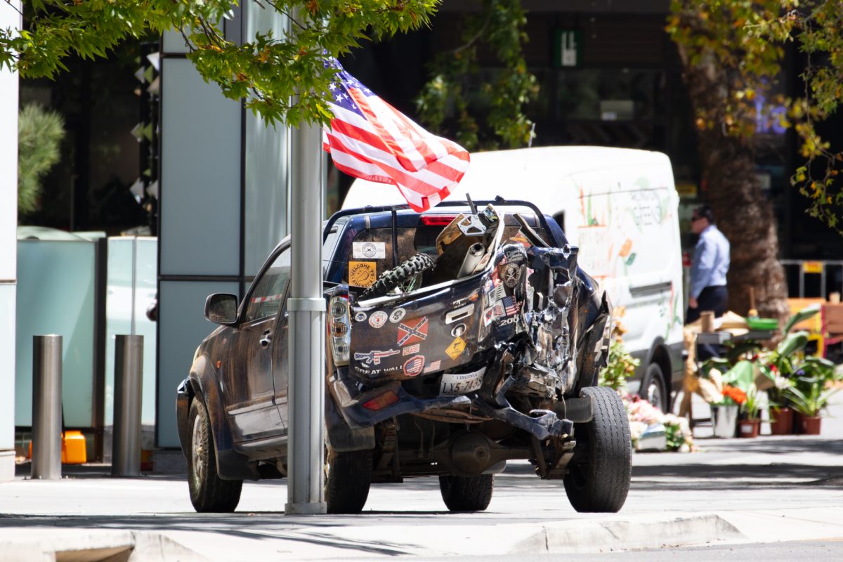 car in street with flag