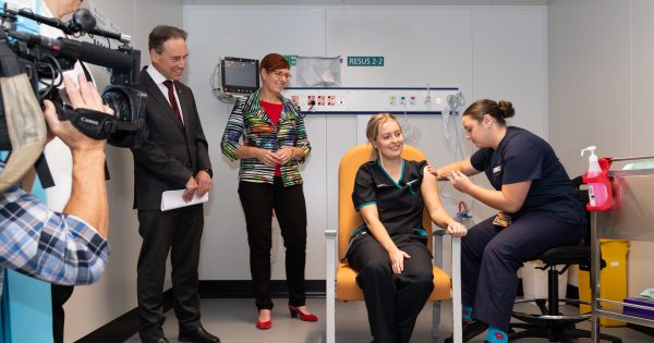 Vaccine capacity tripled as first Canberran becomes fully vaccinated