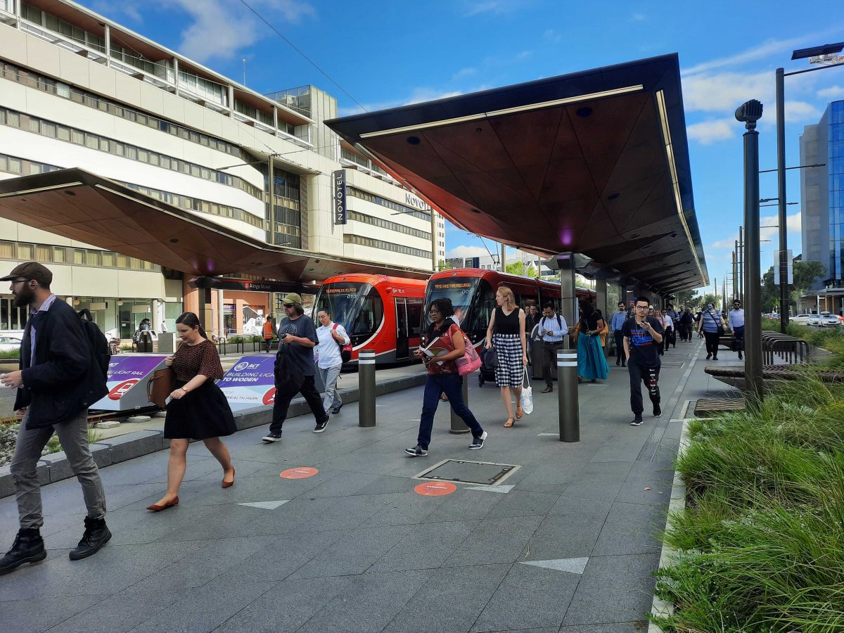 Commuters on light rail platform