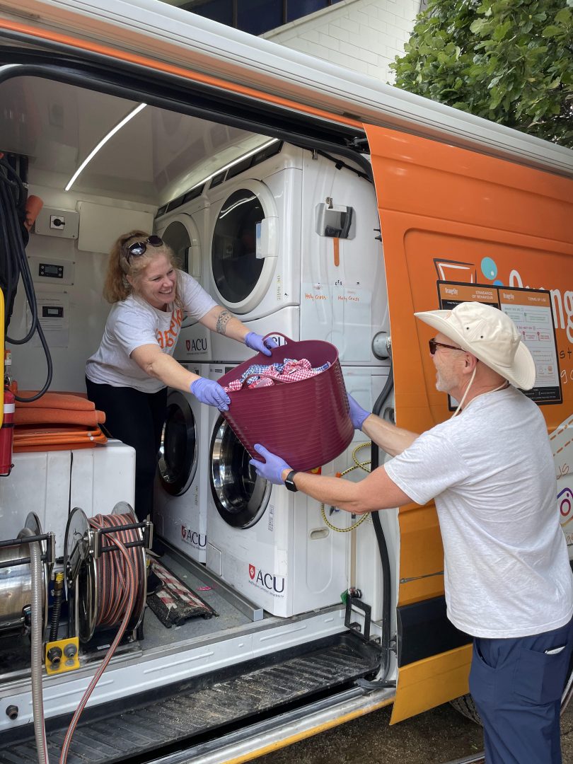 Orange Sky volunteers in van.