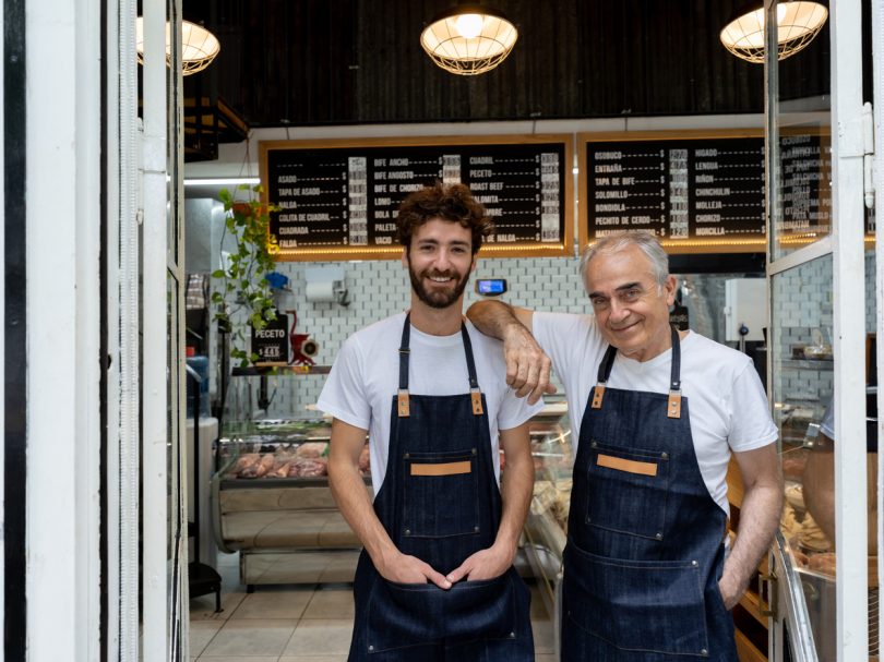 Father and son working at butchery