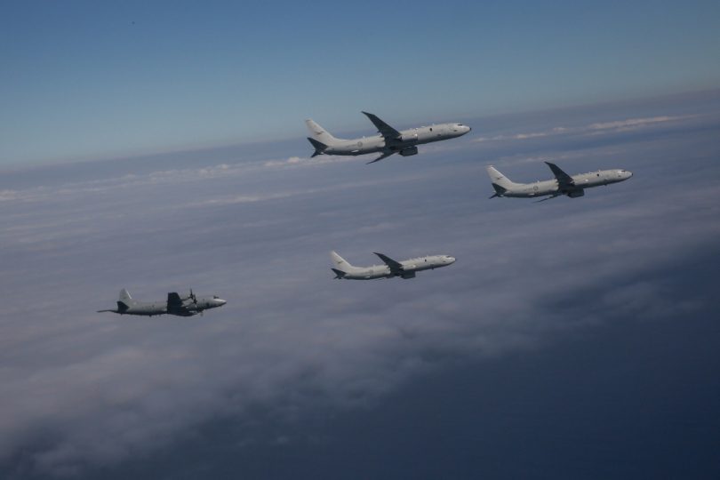 Three P-8A Poseidon aircraft in formation with an AP-3C Orion in preparation for the Air Force centenary flypast in Canberra