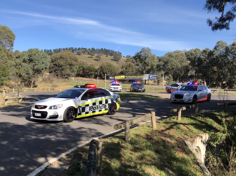 ACT and NSW police vehicles at Kings Highway near Canberra