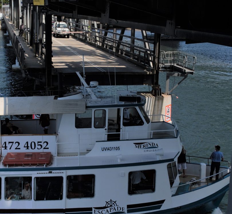 Boat passing under Batemans Bay Bridge.