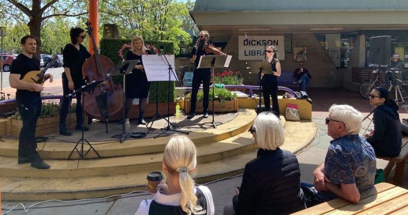 Local musicians performing outdoors at Dickson