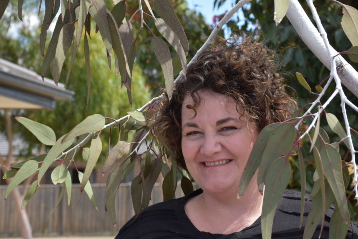 Lisa Conway standing among gum trees