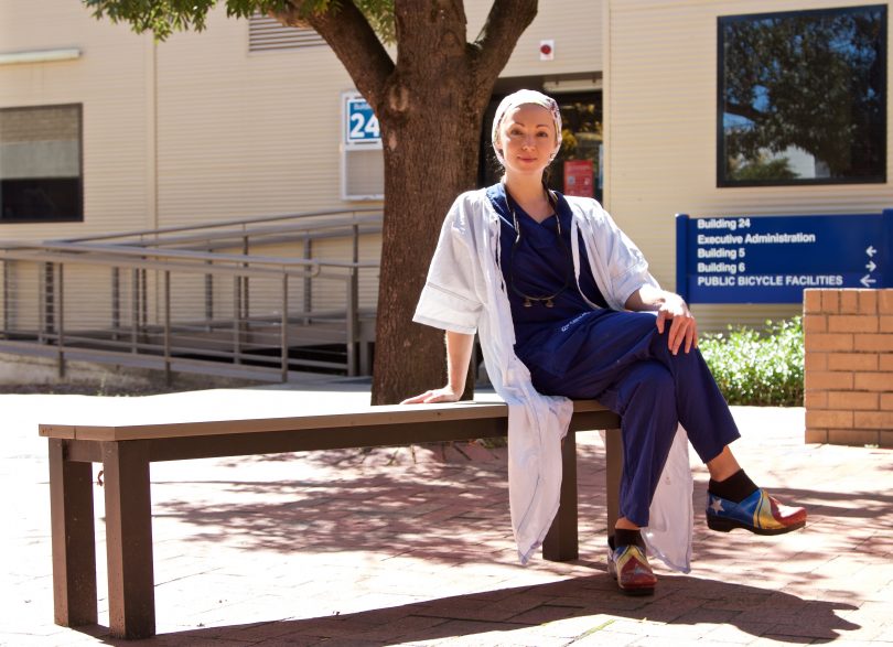 Surgeon at Canberra Hospital Dr Tetyana Kelly sitting on bench at the hospital