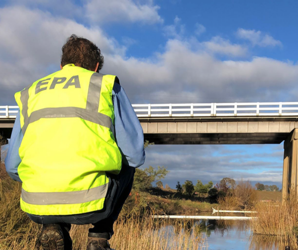 A NSW EPA officer checks pollution levels in the Molonglo River near Queanbeyan.