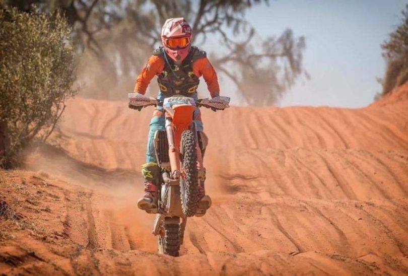 Michael Beard on motorbike in Finke Desert Race.