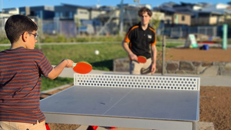 people playing table tennis