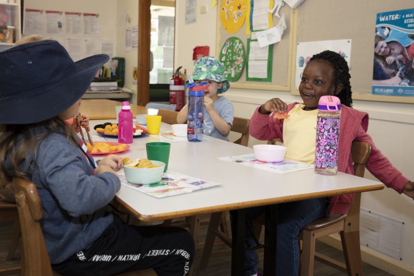 Students sitting at table at WCS Evatt Preschool