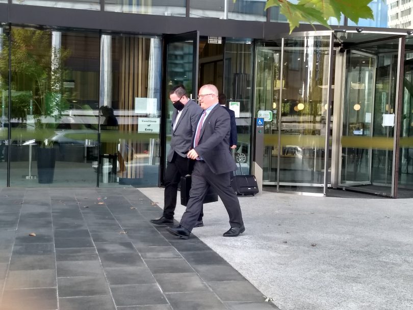 Scott Ian Whittaker leaving court with his lawyer