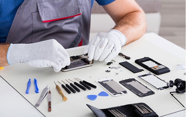 Phone repairer with tools and phone