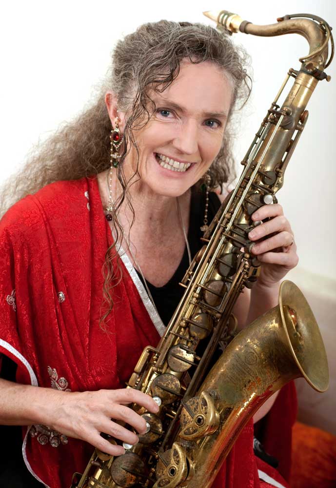 Sandy Evans holding saxophone