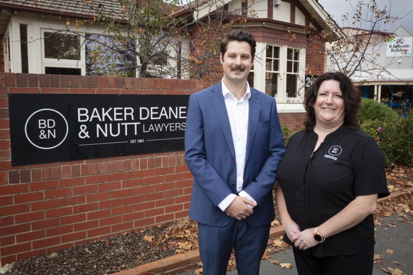 Thomas Cleary and Corrina Tierney standing outside Baker Deane & Nutt Lawyers office