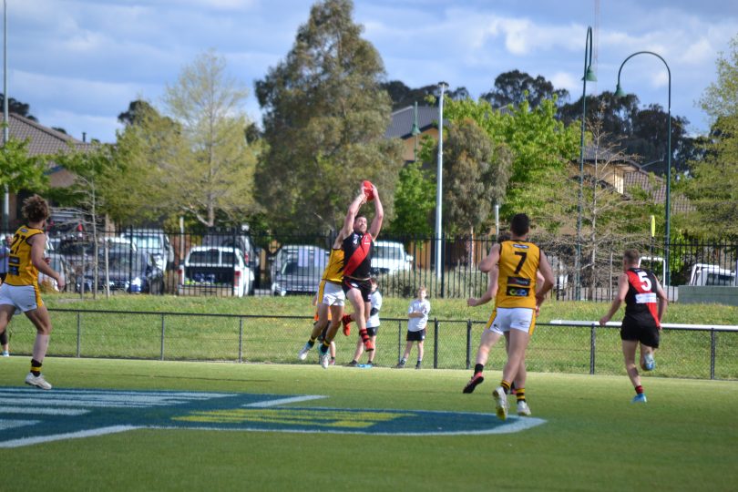 Aaron Bruce marking ball in Australian rules football game