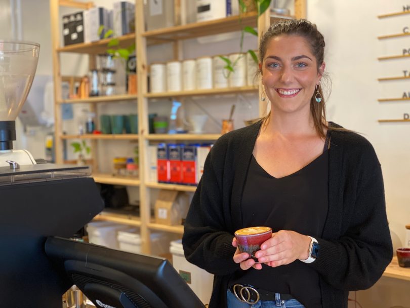 Barista serving coffee at Trader + Co, Yass Valley