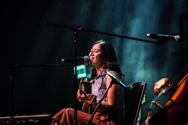 Musician Kim Yang performing onstage