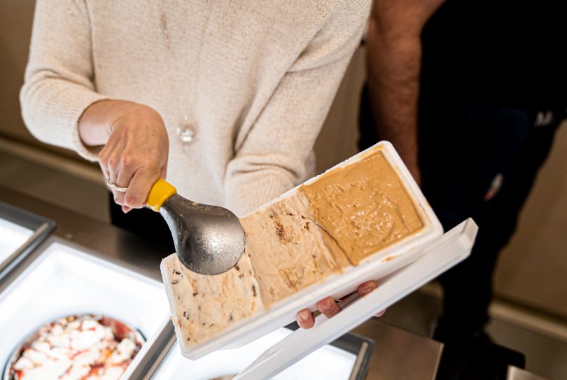 Woman scooping ice-cream