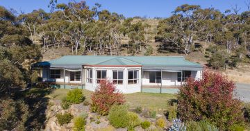 This Wamboin retreat offers tranquil country living and views of rolling hills