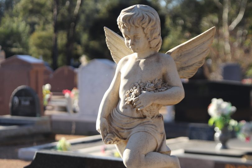 An angel statue on a grave at Gungahlin Cemetery