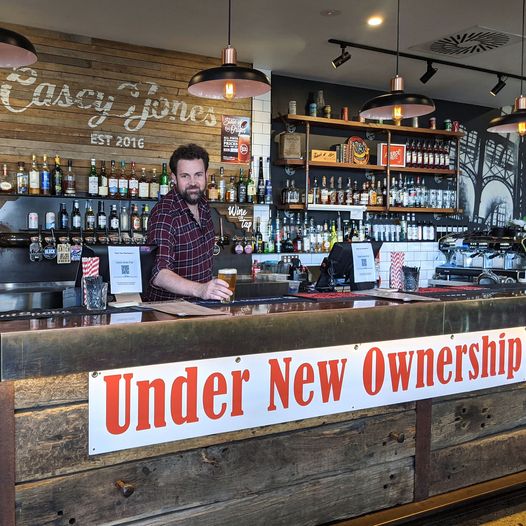 Man behind bar