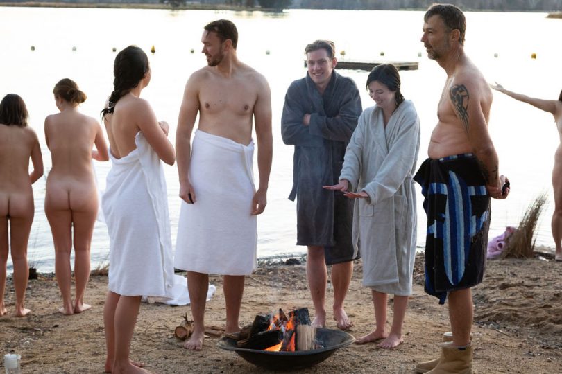 Swimmers warm themselves after the event.