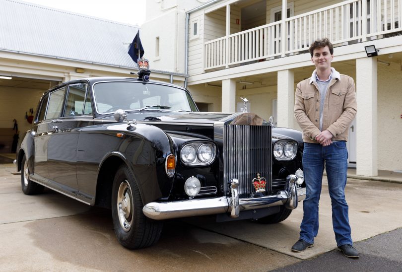 James Coleman standing next to Governor-General's Rolls-Royce outside Government House