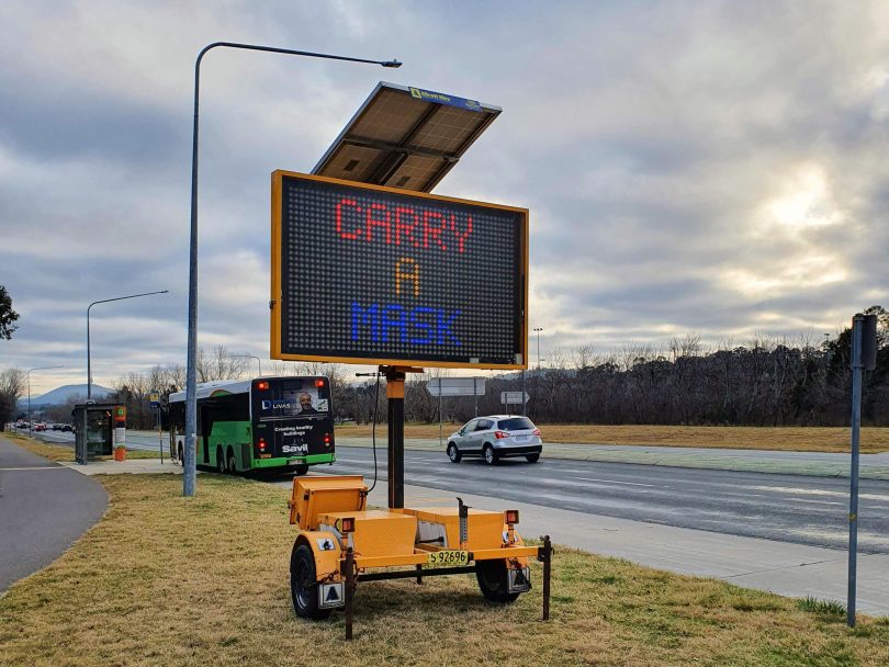 Sign warning Canberrans about new mask requirements