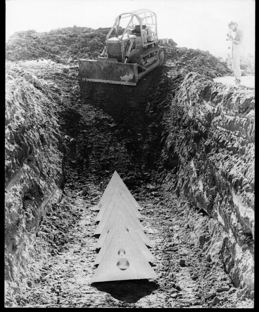 Bert Flugelman's sculpture being buried