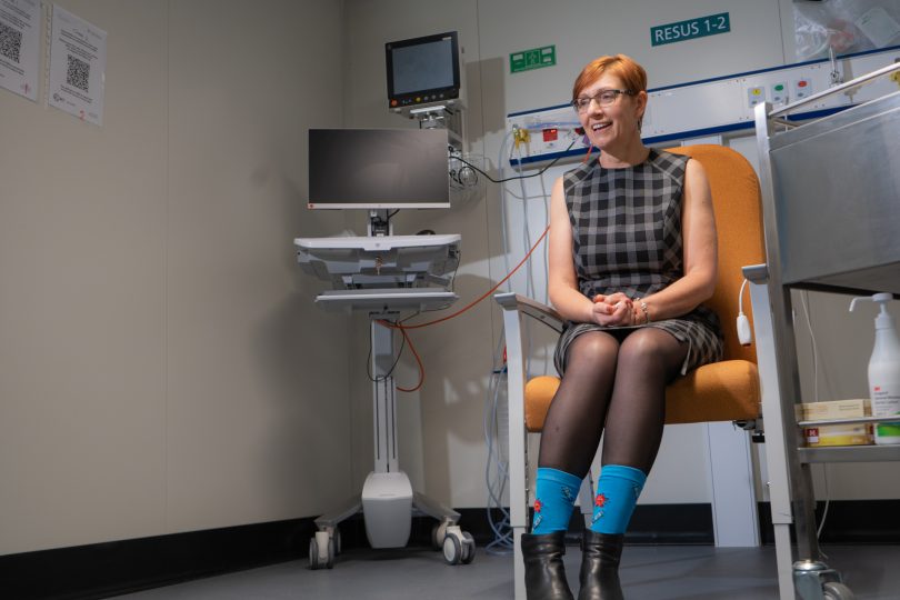 Rachel Stephen-Smith wearing COVID-19 vaccine socks