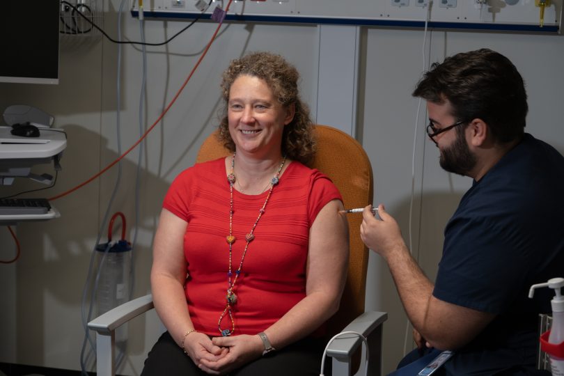 Dr Kerryn Coleman receiving a vaccine