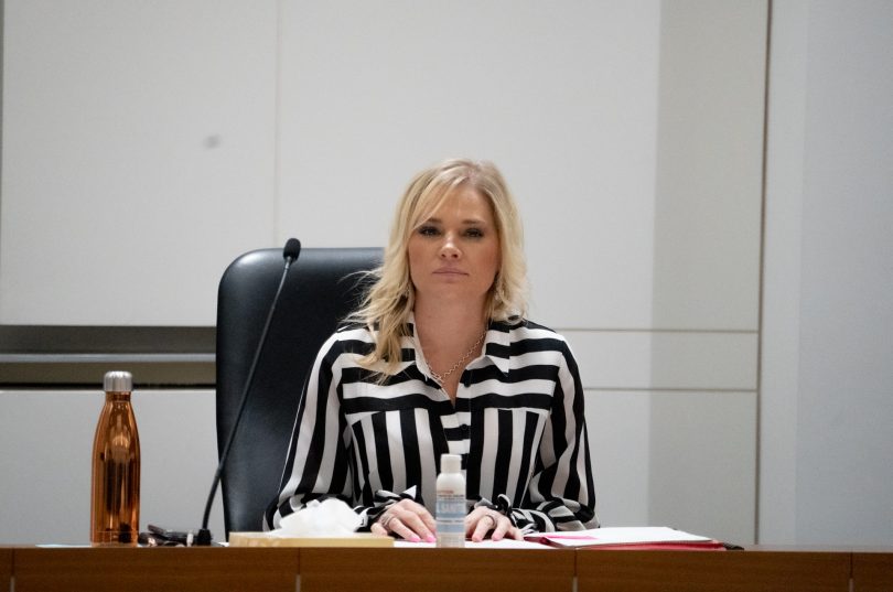 Leanne Castley seated at desk