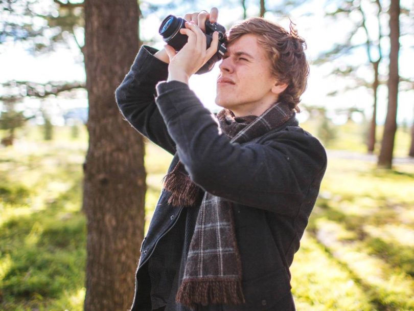 Hayden Shaw taking a photo outdoors