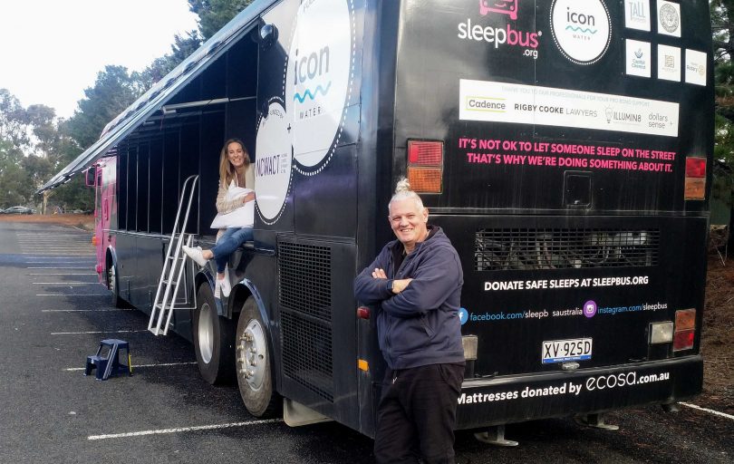 Juanita Flett and Simon Rowe with the Canberra pink sleepbus