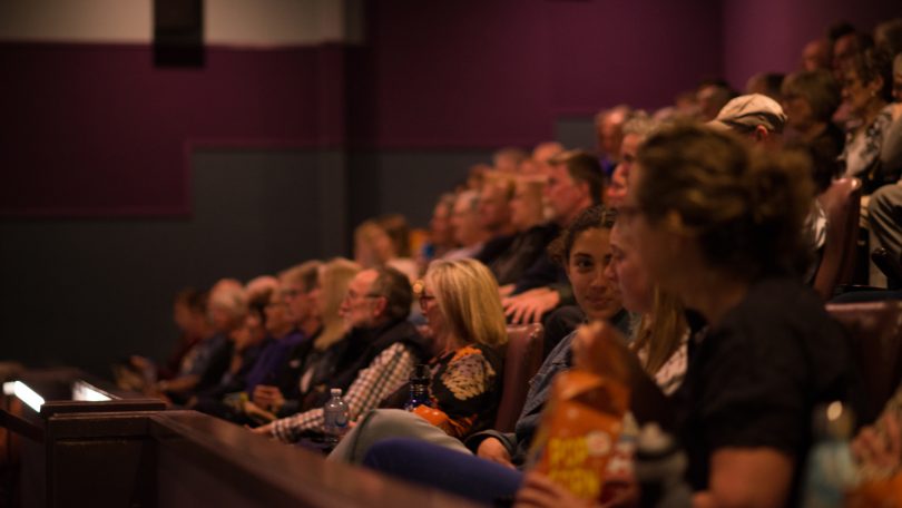 Audience watching movie in cinema