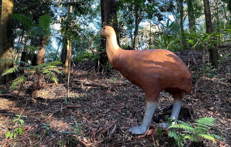 giant bird statue in trees