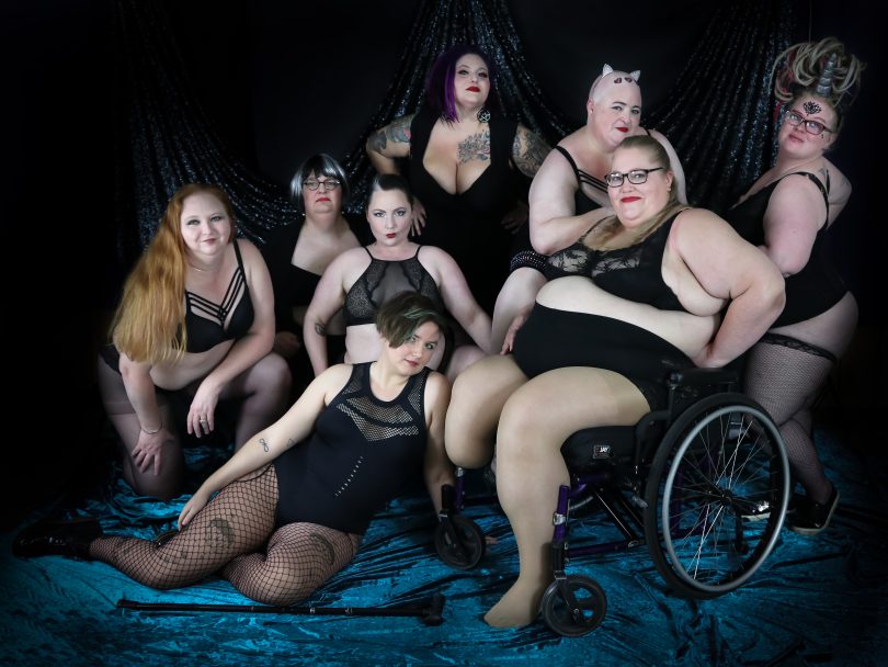 Group of eight Tease-able burlesque students in costume