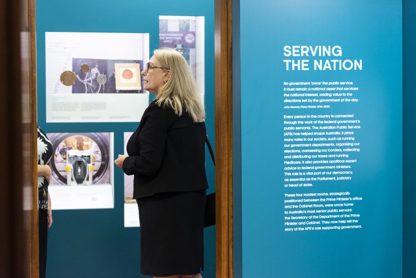 Woman looking at exhibit at Museum of Australian Democracy