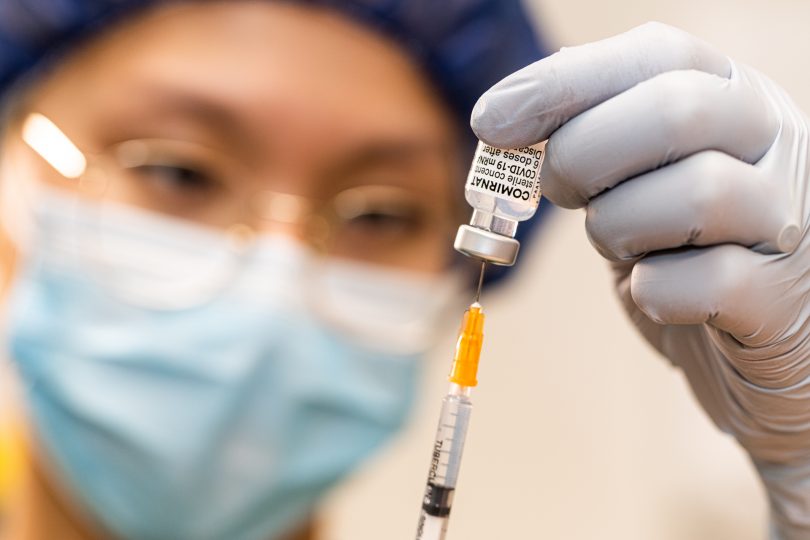 Nurse preparing COVID-19 Pfizer vaccine