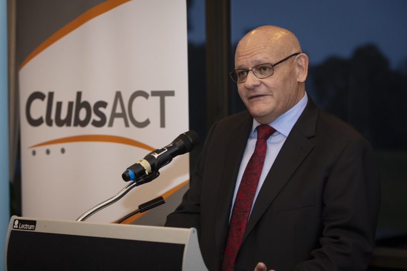 man at lectern