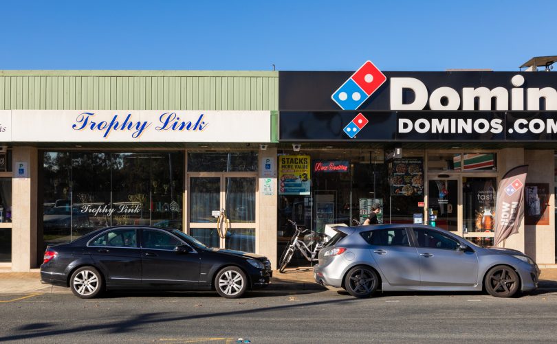 Cars parked in front of Domino's pizza in Mawson