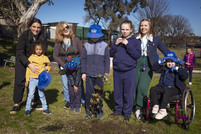 A planted tree and proud gardeners