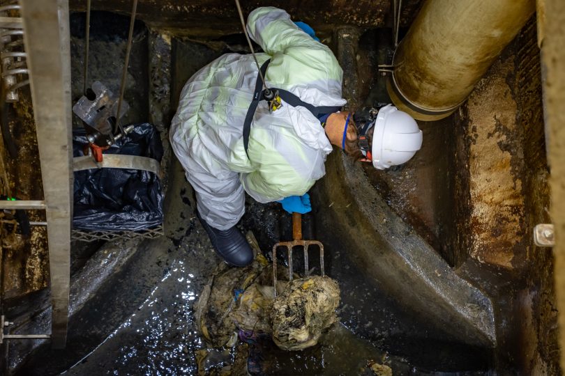 Icon worker clears the Acton syphon sewer vent fan