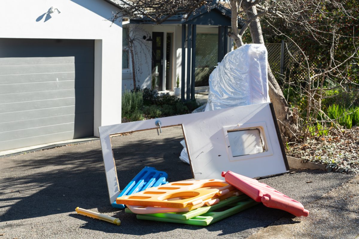 Bulky waste and rubbish outside a house