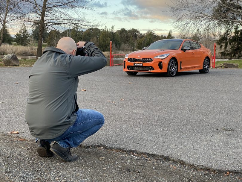 Michael Briguglio taking photo of car