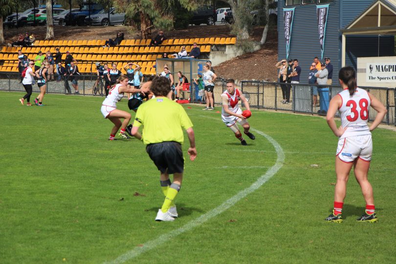 Karina Demant playing Australian rules football for Eastlake Demons