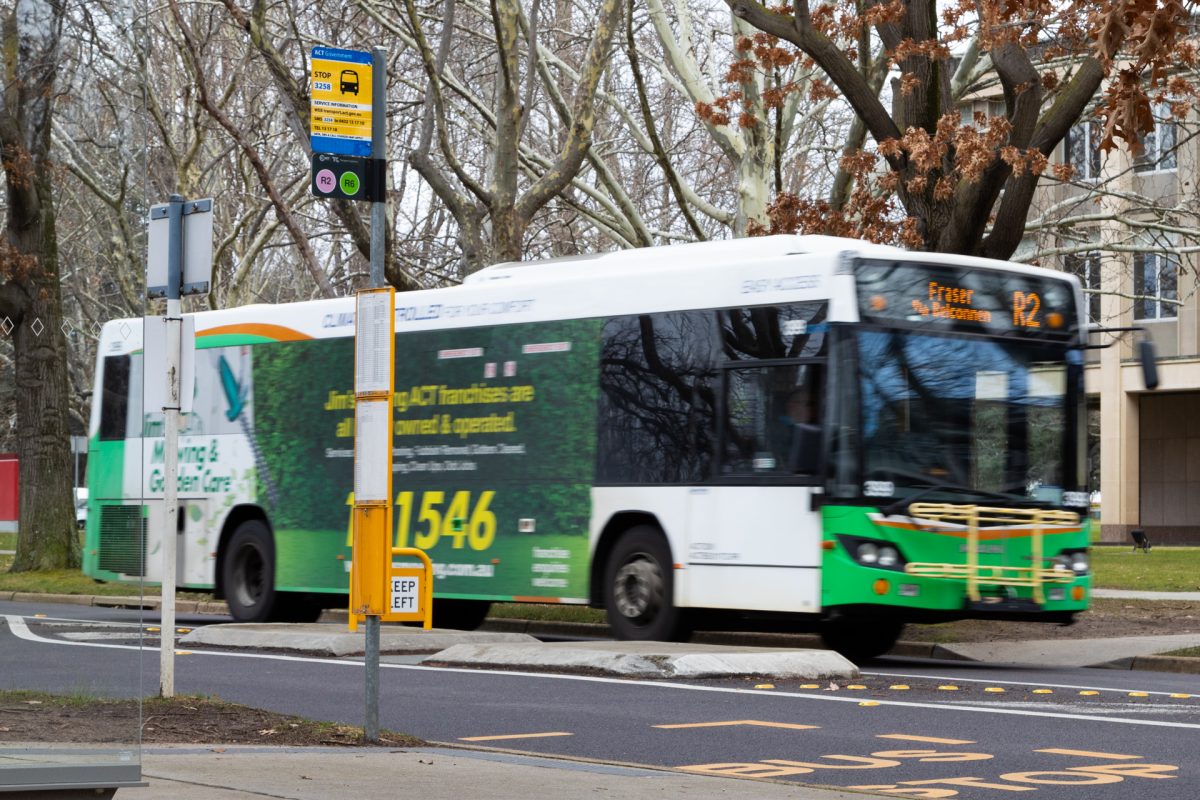 Bus stop sign and bus.