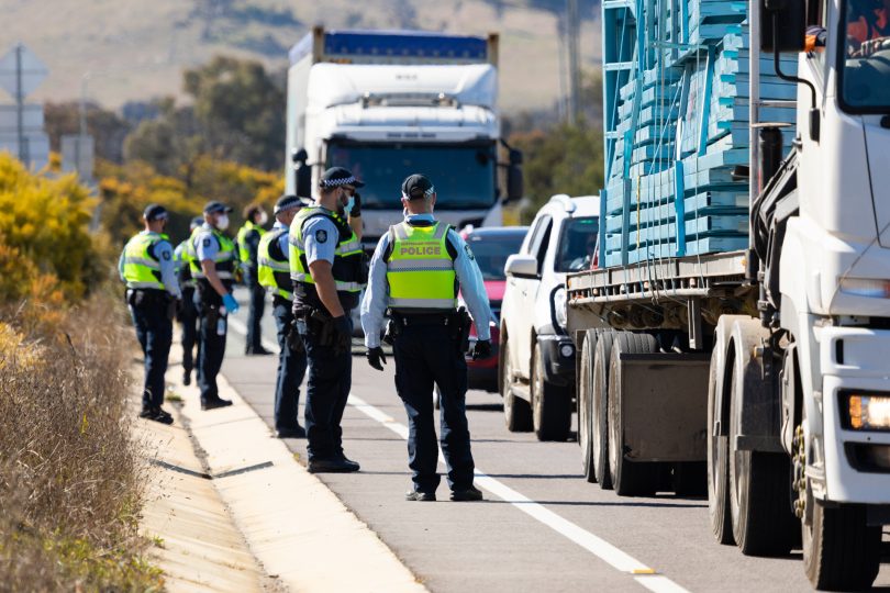 Row of police officers and traffic