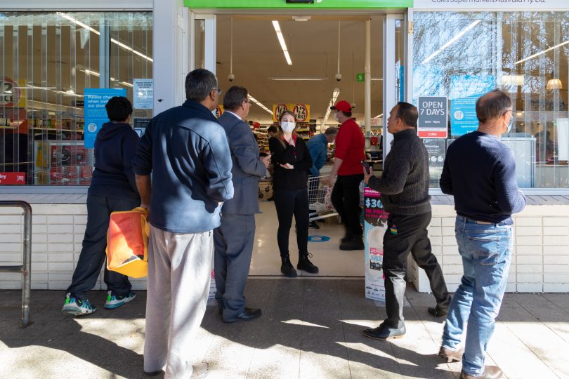 people queuing at Coles curtin